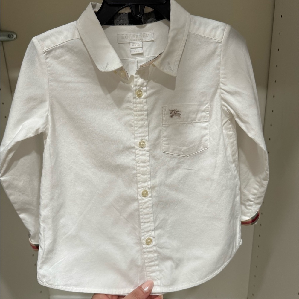 Burberry button shirt. Size 2T and the color is white.
